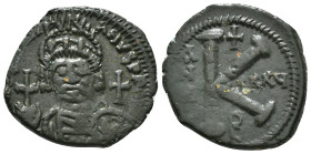 JUSTINIAN I (527-565). Half Follis.
Obv: D N IVSTINIANVS P P AVG.
Helmeted and cuirrased facing bust, holding globus cruciger and shield with horseman...