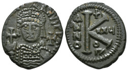 JUSTINIAN I (527-565). Half Follis.
Obv: D N IVSTINIANVS P P AVG.
Helmeted and cuirrased facing bust, holding globus cruciger and shield with horseman...
