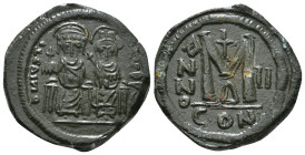JUSTIN II, with SOPHIA (565-578). Follis.
Obv: D N IVSTINVS PP AVG.
Justin and Sophia seated facing on double throne, holding globus cruciger and cruc...