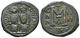JUSTIN II, with SOPHIA (565-578). Follis.
Obv: D N IVSTINVS PP AVG.
Justin and Sophia seated facing on double throne, holding globus cruciger and cruc...