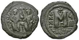 JUSTIN II, with SOPHIA (565-578). Follis.
Obv: D N IVSTINVS PP AVG.
Justin and Sophia seated facing on double throne, holding globus cruciger and cruc...