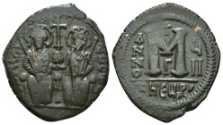 JUSTIN II, with SOPHIA (565-578). Follis.
Obv: D N IVSTINVS PP AVG.
Justin and Sophia seated facing on double throne, holding globus cruciger and cruc...