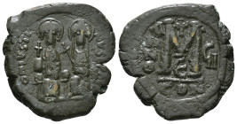 JUSTIN II, with SOPHIA (565-578). Follis.
Obv: D N IVSTINVS PP AVG.
Justin and Sophia seated facing on double throne, holding globus cruciger and cruc...