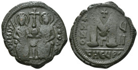 JUSTIN II, with SOPHIA (565-578). Follis.
Obv: D N IVSTINVS PP AVG.
Justin and Sophia seated facing on double throne, holding globus cruciger and cruc...