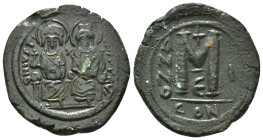 JUSTIN II, with SOPHIA (565-578). Follis.
Obv: D N IVSTINVS PP AVG.
Justin and Sophia seated facing on double throne, holding globus cruciger and cruc...
