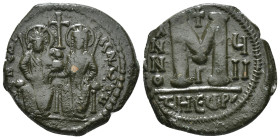 JUSTIN II, with SOPHIA (565-578). Follis.
Obv: D N IVSTINVS PP AVG.
Justin and Sophia seated facing on double throne, holding globus cruciger and cruc...