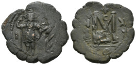Heraclius and Heraclius Constantine (610-641 AD) Constantinople. AE.
Obv. Heraclius holding long cross and his son a globus cruciger; cross between
Re...