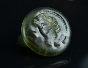 Ancient Roman glass weight with a female head.
5,27 g - 24,95 mm