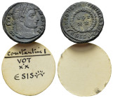 Constantine I (307/310-337). Æ Follis (17mm, 3.21g). Siscia, 321-4. Laureate head r. R/ VOT/XX within wreath; ASIS-sunburst. RIC VII 180. Metal flaws,...