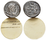 Constantine I (307/310-337). Æ Follis (20mm, 3.52g). Lugdunum, 323-4. Laureate head r. R/ Victory advancing r., holding trophy and palm, spurning capt...
