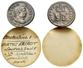 Constantine I (307/310-337). Æ Follis (20mm, 2.68g). Lugdunum, 321. Laureate head r. R/ Standard inscribed VOT/XX flanked by two seated captives; C-R/...