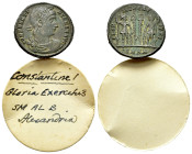 Constantine I (307/310-337). Æ Follis (18mm, 2.44g). Heraclea, 330-3. Rosette-diademed, draped and cuirassed bust r. R/ Two soldiers, each holding spe...
