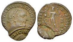 Licinius I (308-324). Æ Follis (20mm, 2.44g). Antioch, 313-4. Laureate head r. R/ Jupiter standing l. holding Victory on globe and sceptre; at feet to...