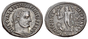 Licinius I (308-324). Æ Follis (20mm,3.09g). Alexandria, 315. Laureate head r. R/ Jupiter standing l. holding Victory on globe and sceptre; at feet to...