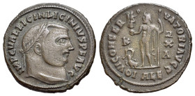Licinius I (308-324). Æ Follis (21mm, 3.60g). Alexandria, 316-7. Laureate head r. R/ Jupiter standing facing, head l., holding Victory on globe and sc...