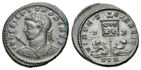 Crispus (Caesar, 316-326). Æ Follis (20mm, 3.59g). Treveri, 320. Laureate and cuirassed bust l., holding spear and shield. R/ Two captives seated at b...