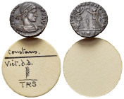 Constans (337-350). Æ (13mm, 1.42g). Treveri, 347-8. Diademed, draped and cuirassed bust r. R/ Two Victories standing facing one another, each holding...
