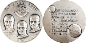 1970 Apollo XIII Art Medal. By Ralph J. Menconi. Silver. Edge No. 1561. Mint State.
64 mm. 136.28 grams, .999 fine, 4.37 troy ounces ASW. Obv: Busts ...