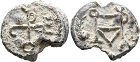Sergios, metropolitan bishop, 6th-7th centuries. Seal (Lead, 22 mm, 7.73 g, 12 h). Cruciform monogram CEPΓIOV within wreath. Rev. Block monogram MHTPO...