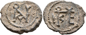 Julianos, bishop, 6th-7th centuries. Seal (Lead, 26 mm, 9.60 g, 12 h). Block monogram IOVΛIANOV. Rev. Block monogram ΕΠICKOΠOV. Unpublished in the sta...