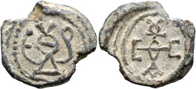 Theodoros and Eustathios, 6th-7th centuries. Seal (Lead, 24 mm, 8.02 g, 12 h). Monogram ΘЄOΔOPIOV. Rev. Cruciform monogram EVCTAΘIOV. Unpublished in t...