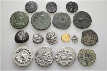 A lot containing 17 gold, silver and bronze coins. Including: Greek, Roman Provincial, Crusaders and Islamic. About very fine to very fine. LOT SOLD A...