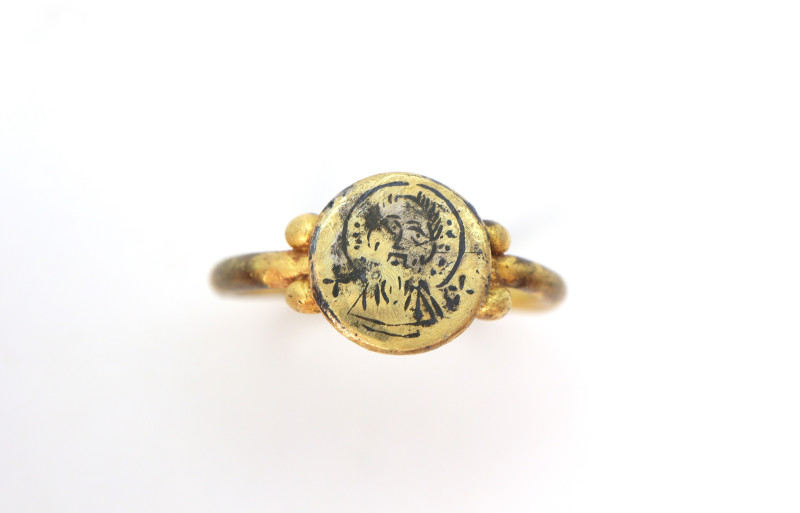 A heavy Byzantine ring with solid O sectioned band , oval bezel with image of Ch...