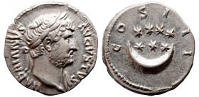 Roman Imperial 
Hadrian AR Denarius. Rome, AD 125-128. HADRIANVS AVGVSTVS, laureate head right / COS III, seven stars two lines 4 + 3 above crescent....