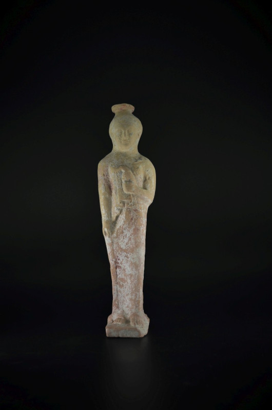 Rhodian alabastron in form of a kore with dove. 560 - 550 BC. Height 26,5cm. Fig...