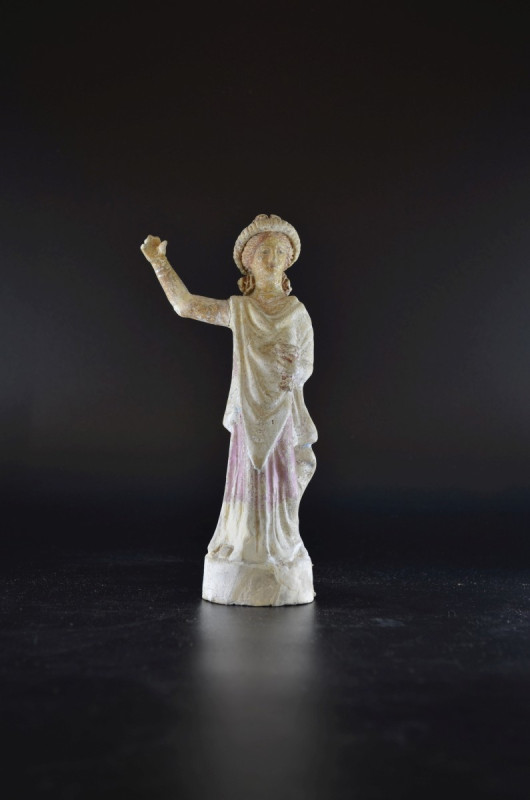 Statuette of a girl with wreath. Attica, 350 - 325 BC. Height 19,4cm. Light brow...