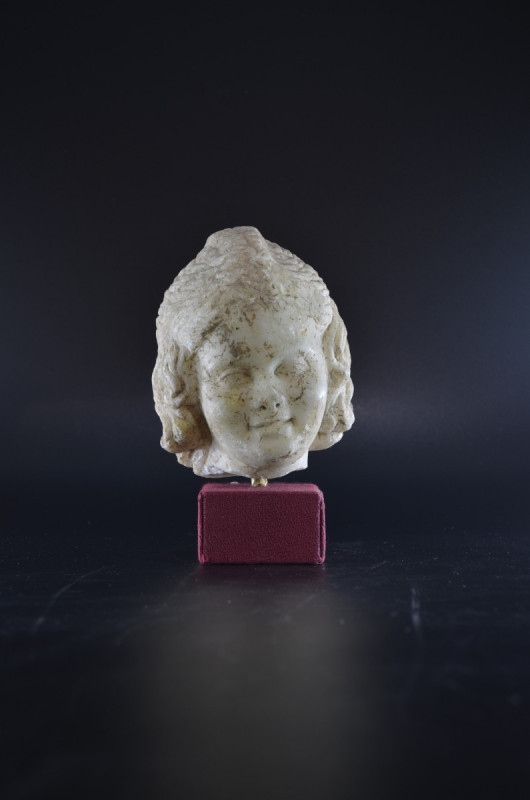 Roman head of a girl. Augustean, End of 1st century BC. Height 13,9cm and with s...