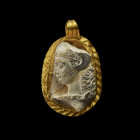 A large gold-framed pendant with a white cameo showing the bust of young Herakles wearing the lion´s scalp. 3rd century AD. Fixed crack. Splinters mis...