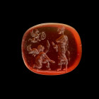 Gemstone with tragedian. Roman, late 1st century BC - 1st century AD. 0,9 x 1,1cm. Oblong intaglio made of ligth red cornelian with plain back. On the...