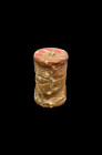 Cylinder seal reddish-brown stone with white dots. Akkadian, about 2300 - 2100 BC. H 3.4cm, ø 2.1cm. A kneeling bull in front of winged gate. A entron...