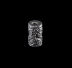 A cypriot hematite cylinder seal with different animal motifs: A griffon attacking a lion, a male ibex jumps on a female and other motifs. Cypriot, 2n...