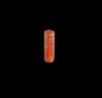 A neobabylonian cylinder seal made of carnelian depicting two bearded men beside a stand with a lying animal on top. About ath century BC. Intact. Rol...