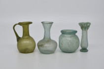 Collection of different glass vessels. H 8,2-11,8cm. Roman, 3rd - 4th century A. D. 4 pieces! Iridescence, intact. Publiziert in: J. van der Groen, Ro...
