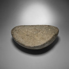 A triangular basalt dish, Teneré, about 6000 BC. Intact with felt on bottom. Neolithische Steinschale. Teneré, um 6000 v. Chr. Subtriangulare, flache ...