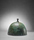 Northern Europe Ha B1, 1000 BC. H 17.3cm. Bronze bell helmet with separately cast crown pommel, a square plate riveted on as a lower bearing. Traces o...