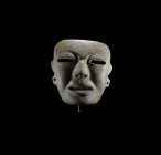 Olmec, 1000 - 500 BC. H 20.5cm, W 6cm. Serpentine mask with human features and slit-shaped openings for the eyes and mouth. Four holes are placed in t...