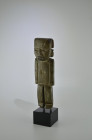 Teotihuacan, 300 - 600 AD. H 21.5cm. Serpentine statuette in the shape of a standing man with a large, broad head and slit-shaped eyes, dressed with a...