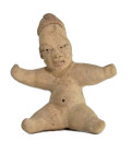 Olmec, 900 - 500 BC. H 17.5cm. Clay with kaolin coating, traces of red paint (hematite). Figure of a child with oversized head, tubular headgear, arms...