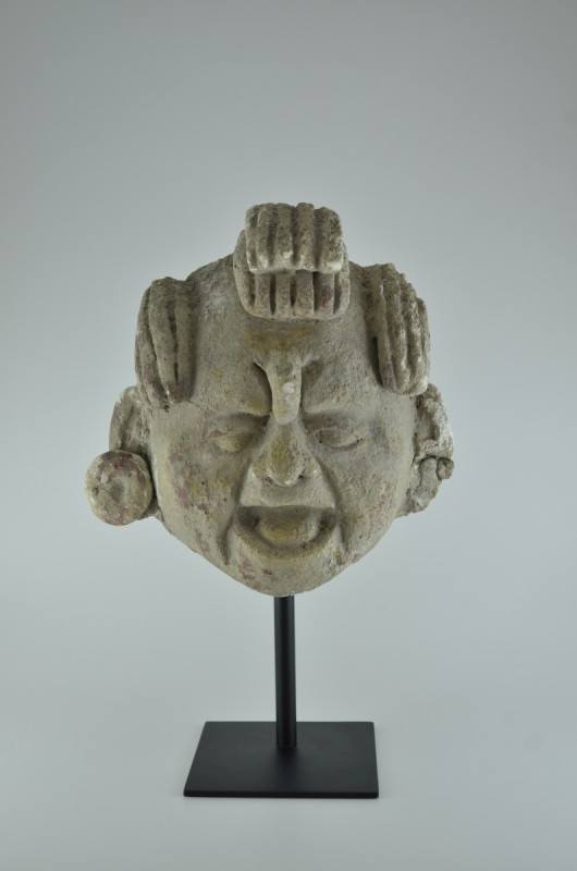 Maya 550 - 950 AD. H 26cm, W 12cm. Stucco head of a man with elderly, wrinkled f...