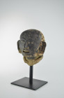 Veracruz, Remojadas, 550 - 950 AD. H 14.8cm. Terracotta head of an incense vessel. Contrary to most of these heads which show a somewhat fierce and ag...