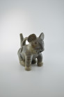 Moche, 500 AD. H 17.5cm. Dark-grey clay with brown paint. Vessel with stirrup handle in form of a pampas cat with striped legs and dots on its back, s...