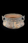 Omereque, 500 - 1000 AD. H 8.6cm. Bowl-shaped clay vessel with two strap handles and polychrome paint. The body has eight bulges painted with a double...