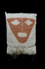 Chancay, 1000 - 1200 AD. H 37 cm. Textile fabric with human face painted in red. This object was applied as a replacement head for mummies. Published!...