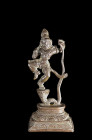 Statuette of Krishna dancing on the snake demon Kaliya. India, 16th century. Height 16,5cm. Detailed small bronze of 'Bal Krishna' on a profiled lotus...