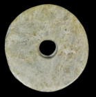 Small Neolithic bi-disc. Liangzhu culture, ca. 3300 -2300 BC. ø 12cm, rim width approx. 1cm. ø 12cm, rim width approx. 1cm. A beautiful bi-disc hand-c...