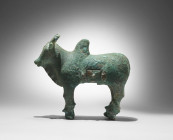 A bronze figure of a zebu bull. L 27,7cm H 23cm. On the top of the back a slot and a drawer at the side. Bulls which symbolized strength and potency t...